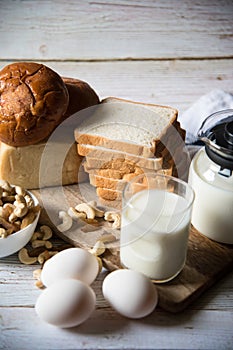 Healthy breakfast menu comprising of milk, eggs, nuts and bread