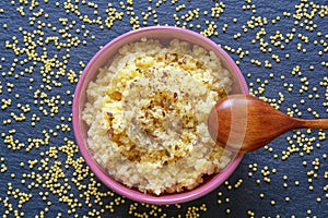 Healthy breakfast. Millet porridge in bowl on table