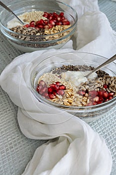 Healthy breakfast mood, muesli with pomegranate, sunflower and sesame seeds