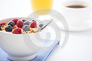 Healthy breakfast with muesli, fresh fruit, orange juice and cof