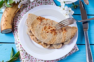 Healthy breakfast - pancake from oatmeal with banana and cheese