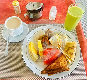 Healthy Breakfast Plate with Fresh Fruit and Drinks