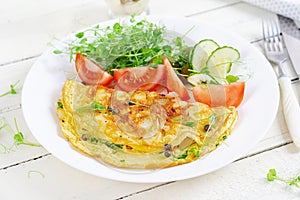 Healthy breakfast.Quesadilla with omelette, bacon and tomatoes salad.