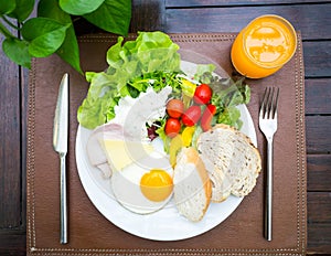 Healthy breakfast, salad, bread, ham and egg