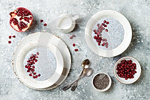 Healthy breakfast set. Chia seed pudding bowls with pomegranate