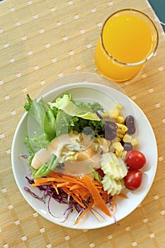 Healthy breakfast set, Fresh vegetable salad and orange juice