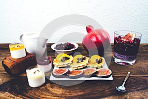 Healthy breakfast set on rustic wooden table.