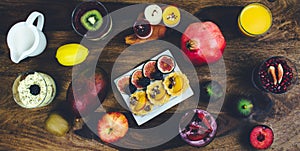 Healthy breakfast set on rustic wooden table.