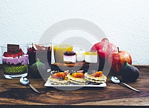 Healthy breakfast set on rustic wooden table.