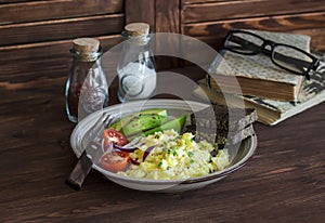 Healthy breakfast or snack - eggs scramble, avocado and cherry tomatoes