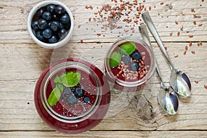 Healthy Breakfast. Summer dessert. Smoothies of blueberries with Chia seeds and flax seed and fresh juicy berries