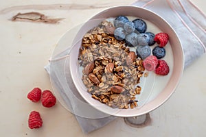 Healthy breakfast super food cereal concept with fresh fruit, granola, yoghurt