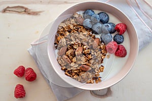 Healthy breakfast super food cereal concept with fresh fruit, granola, yoghurt