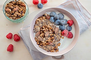 Healthy breakfast super food cereal concept with fresh fruit, granola, yoghurt