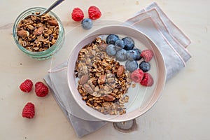 Healthy breakfast super food cereal concept with fresh fruit, granola, yoghurt