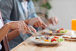 Healthy Breakfast Time. Unrecognizable Couple Eating Morning Meal In Kitchen