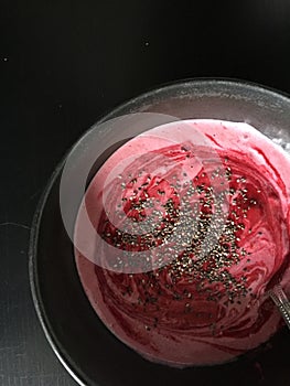 Healthy breakfast: vegan raspberry buckwheat smoothie bowl with chia seeds
