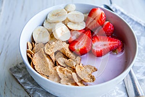 Healthy Breakfast which included cornflakes and oatflakes, yogurt, bananas photo