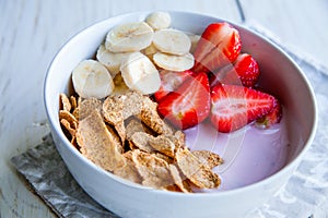 Healthy Breakfast which included cornflakes and oatflakes, yogurt, bananas photo