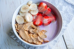 Healthy Breakfast which included cornflakes and oatflakes, yogurt, bananas photo