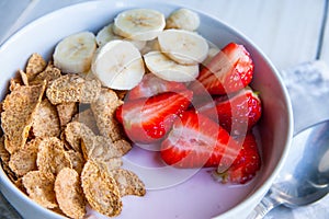 Healthy Breakfast which included cornflakes and oatflakes, yogurt, bananas photo