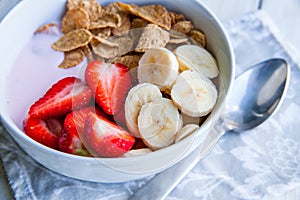 Healthy Breakfast which included cornflakes and oatflakes, yogurt, bananas photo