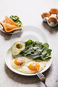 Healthy Breakfast with Wholemeal Bread Toast, Eggs with Green Salad, Avocado. traditional breakfast