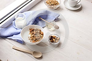 Healthy breakfast on window sill homemade granola with nuts