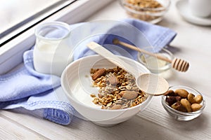 Healthy breakfast on window sill homemade granola with nuts