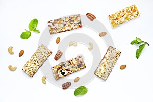 Cereal granola bars with nuts and dry berries on a white background. Top view healthy snack.