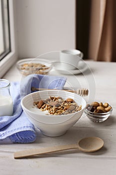 Healthy breakfast on window sill homemade granola with nuts