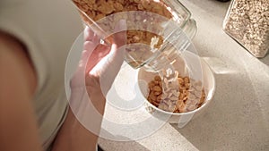 Healthy Breakfast. Woman Hands Filling Bowl By Cereals Muesli