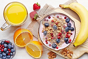 Healthy breakfast. Yogurt with granola and berries