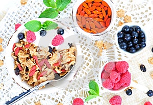 Healthy breakfast, yogurt with granola and berries on the white table