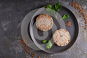 Healthy buckwheat crispbreads on a dark background Copy space