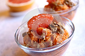 Healthy carrot salad with grapefruit and walnuts
