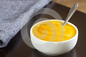 Healthy Carrot soup in a white bowl