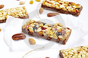 Healthy cereal bars on texture table, with copy space top view