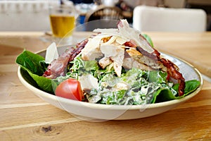 Healthy chicken salad in a pub close up
