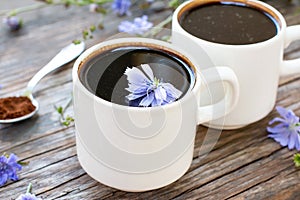 Healthy chicory drink in cup decorated chicory flowers.Herbal beverage, coffee substitute
