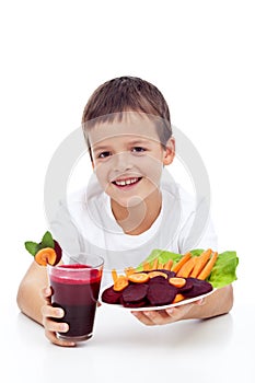 Healthy child with fresh beetroot juice