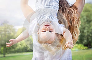 Healthy child (kid) having fun with mother in the sunny summer day. Caucasians happy baby (boy)..