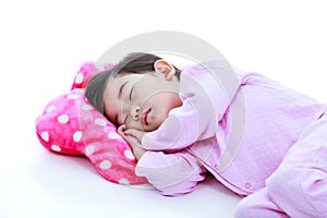 Healthy children concept. Asian girl sleeping peacefully. On white background.