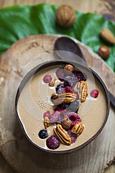 Healthy chocolate smoothie with berries and nuts