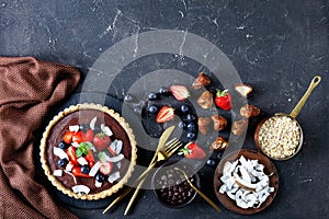 Healthy chocolate tart with strawberries on top