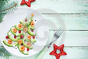 Healthy Christmas appetizer snack - avocado salmon cranberry Christmas tree