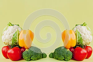 Healthy clean eating layout, vegetarian food and diet nutrition concept. Various fresh vegetables ingredients for salad on yellow