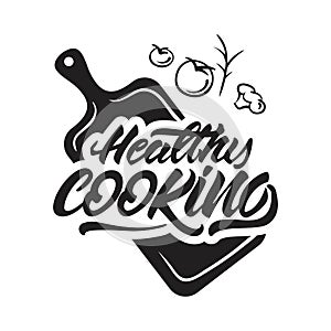 Healthy cooking lettering illustration on cutting board with vegetables. Vector illustration