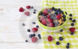 Healthy corn flakes breakfast on the white wooden table