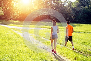 Healthy couple jogging in nature